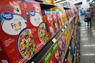 A customer walks past a display of Great Value brand cereal at a Walmart Neighborhood Market, Friday, Sept. 26, 2025, in Bentonville, Ark.