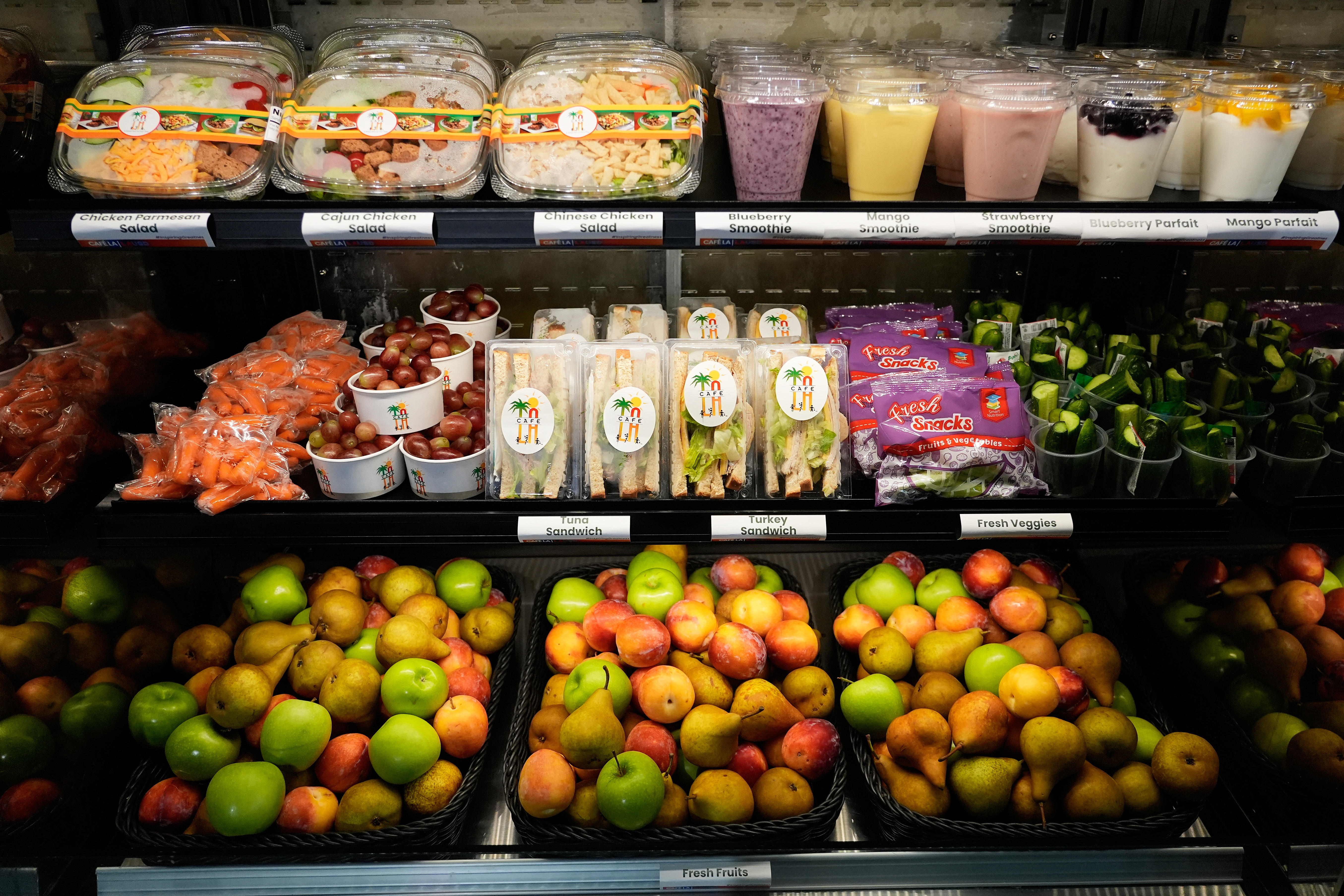A selection of produce from California farmers and other food offered on the Belvedere Middle School menu is displayed before a news conference with Gov. Gavin Newsom, Wednesday, Oct. 8, 2025, in Los Angeles.