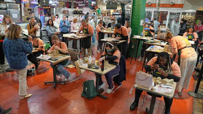 Contestants work on their entries in Scrapple Sculpting Contest at the Reading Terminal Market in Philadelphia, Friday, Oct. 10, 2025.