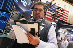 Trader Michael Capolino works on the floor of the New York Stock Exchange, Wednesday, Oct. 15, 2025.