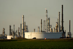 A motorist drives past the CHS oil refinery Sept. 28, 2024, in McPherson, Kan.