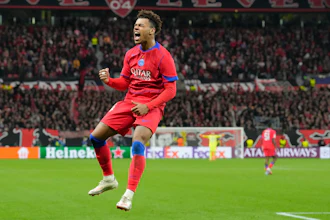 PSG's Desire Doue celebrates after scoring his side's second goal during a Champions League match between Bayer Leverkusen and Paris Saint-Germain, Leverkusen, Germany, Oct. 21, 2025.