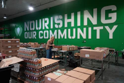 Mara Sleeter, marketing and communications project manager, stands near boxes of juice while being interviewed in the San Francisco-Marin Food Bank warehouse in San Francisco, July 2, 2025.