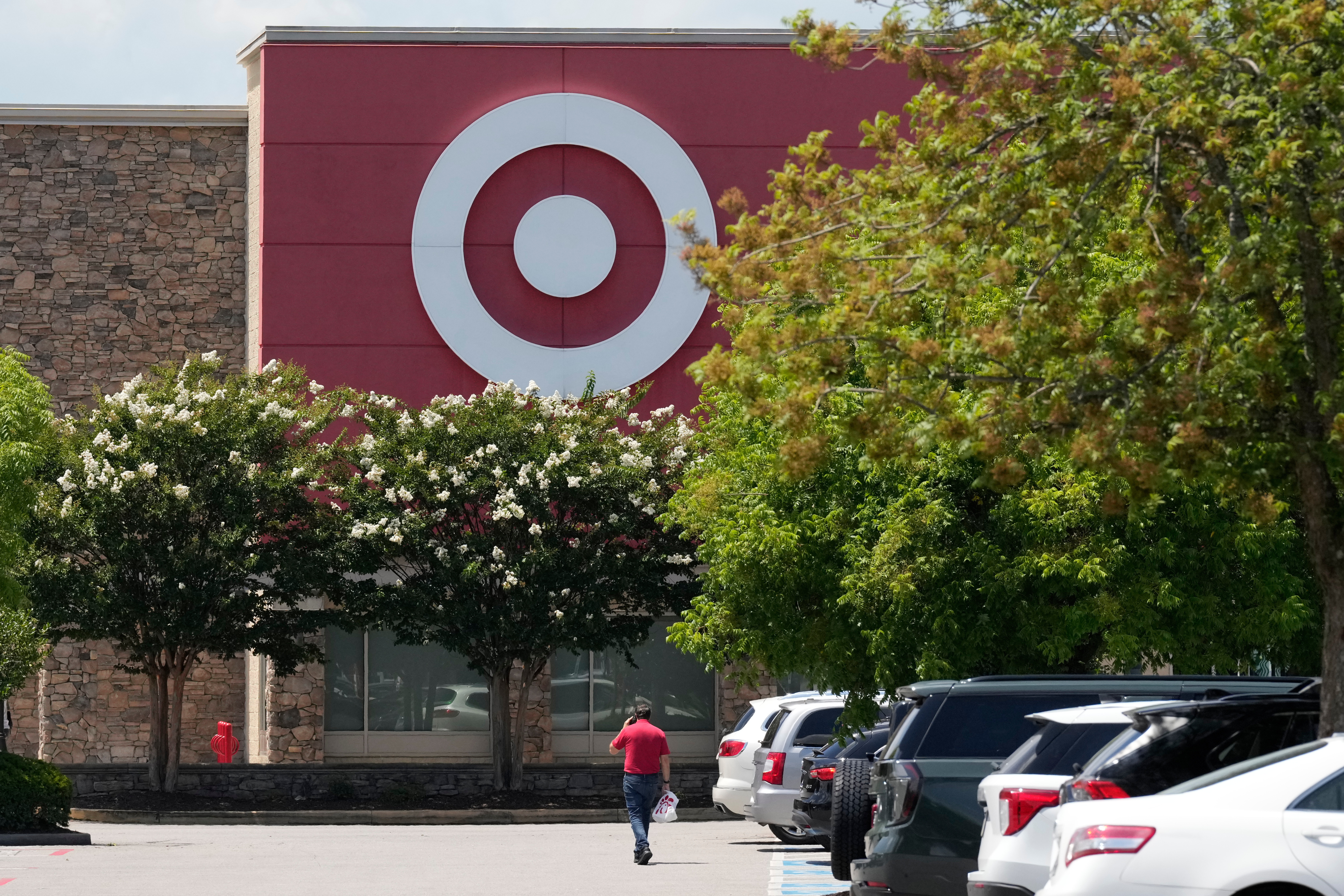 A person walks towards a Target store, July 15, 2025, in Nashville, Tenn.