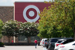 A person walks towards a Target store, July 15, 2025, in Nashville, Tenn.