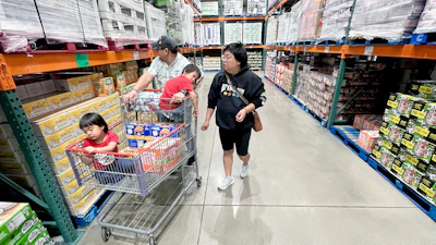 KC Neufeld, right, shops with her family in Englewood, Colo., Wednesday, Oct. 29, 2025.
