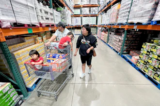 KC Neufeld, right, shops with her family in Englewood, Colo., Wednesday, Oct. 29, 2025.