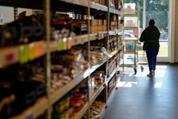 A woman shops for food at MUST Ministries Food Distribution Center, Friday, Oct. 31, 2025, in Marietta.