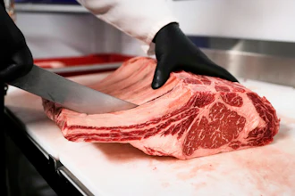 Raul Rubero, lead butcher at Deep Cuts butcher shop cuts single portions of bone-in steaks as he breaks down a side of beef, Wednesday, Aug. 27, 2025, in Dallas.