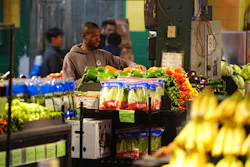 A worker arranges produce at the Reading Terminal Market in Philadelphia, Oct. 29, 2025.
