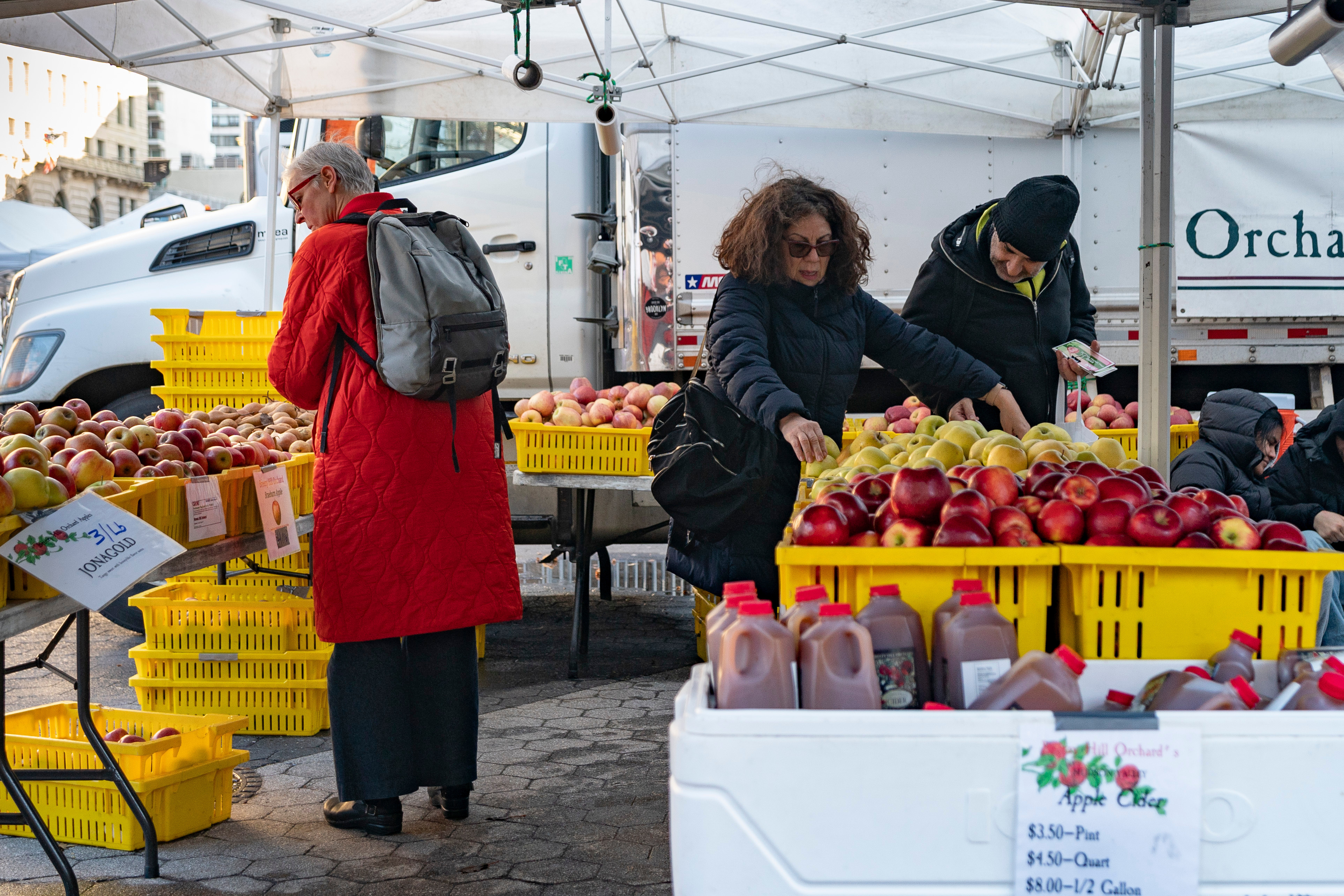 Customers browse farmer's market displays in Union Square, Jan. 13, 2024, in New York.