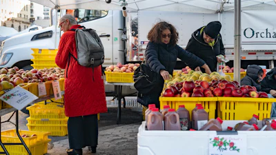 Customers browse farmer's market displays in Union Square, Jan. 13, 2024, in New York.