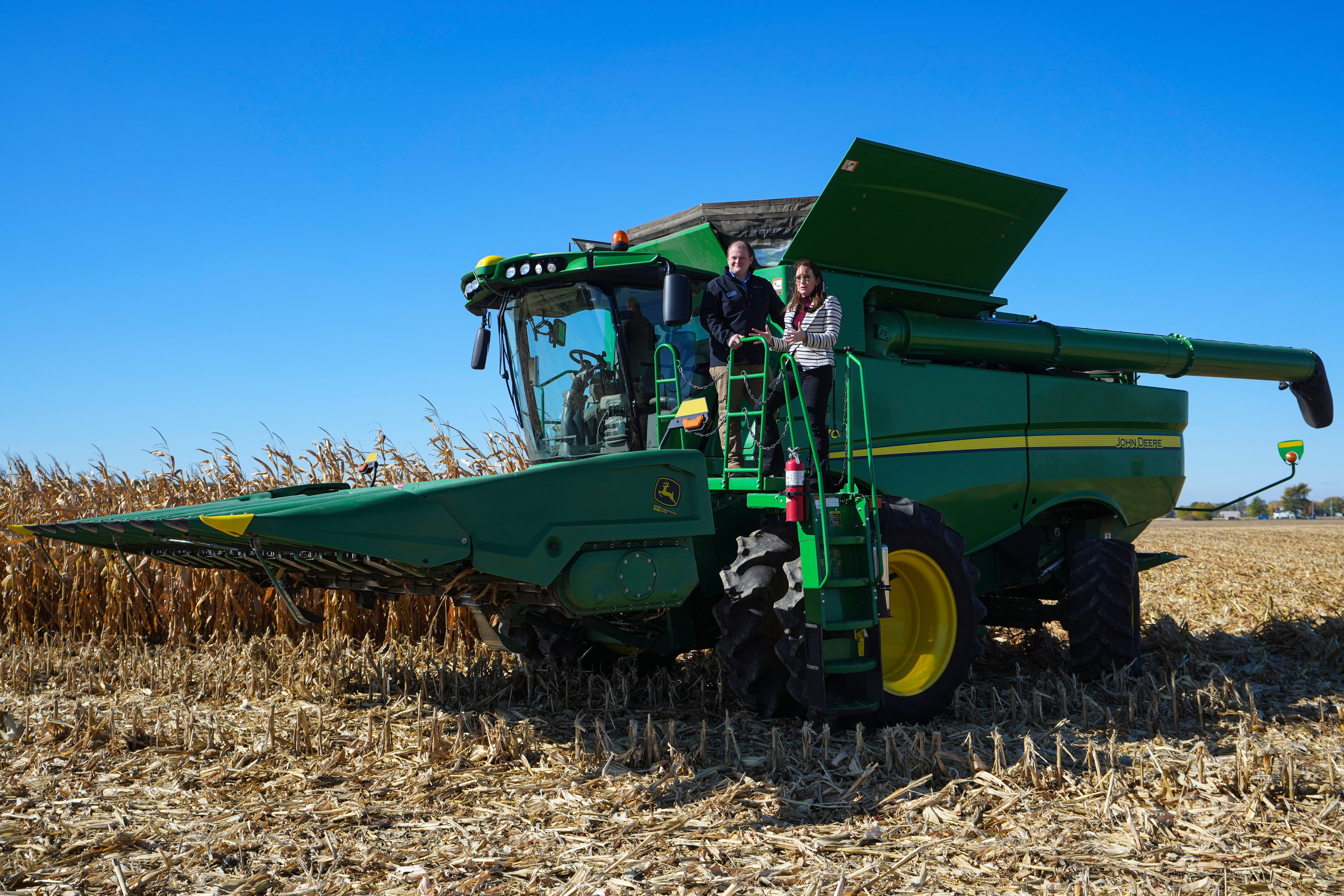 U.S. Secretary of Agriculture Brooke L. Rollins, right, films a social media post on a combine with farm owner Tyler Everett during a farm tour in Lebanon, Ind., Thursday, Oct. 30, 2025.
