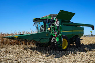 U.S. Secretary of Agriculture Brooke L. Rollins, right, films a social media post on a combine with farm owner Tyler Everett during a farm tour in Lebanon, Ind., Thursday, Oct. 30, 2025.