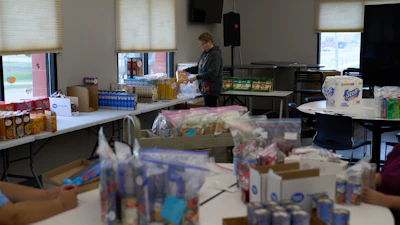 Jen Janecek Hartman helps prepare bagged meals for a food bank for students at Nueta Hidatsa Sahnish College, Thursday, Oct. 30, 2025, in New Town, N.D.