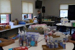 Jen Janecek Hartman helps prepare bagged meals for a food bank for students at Nueta Hidatsa Sahnish College, Thursday, Oct. 30, 2025, in New Town, N.D.