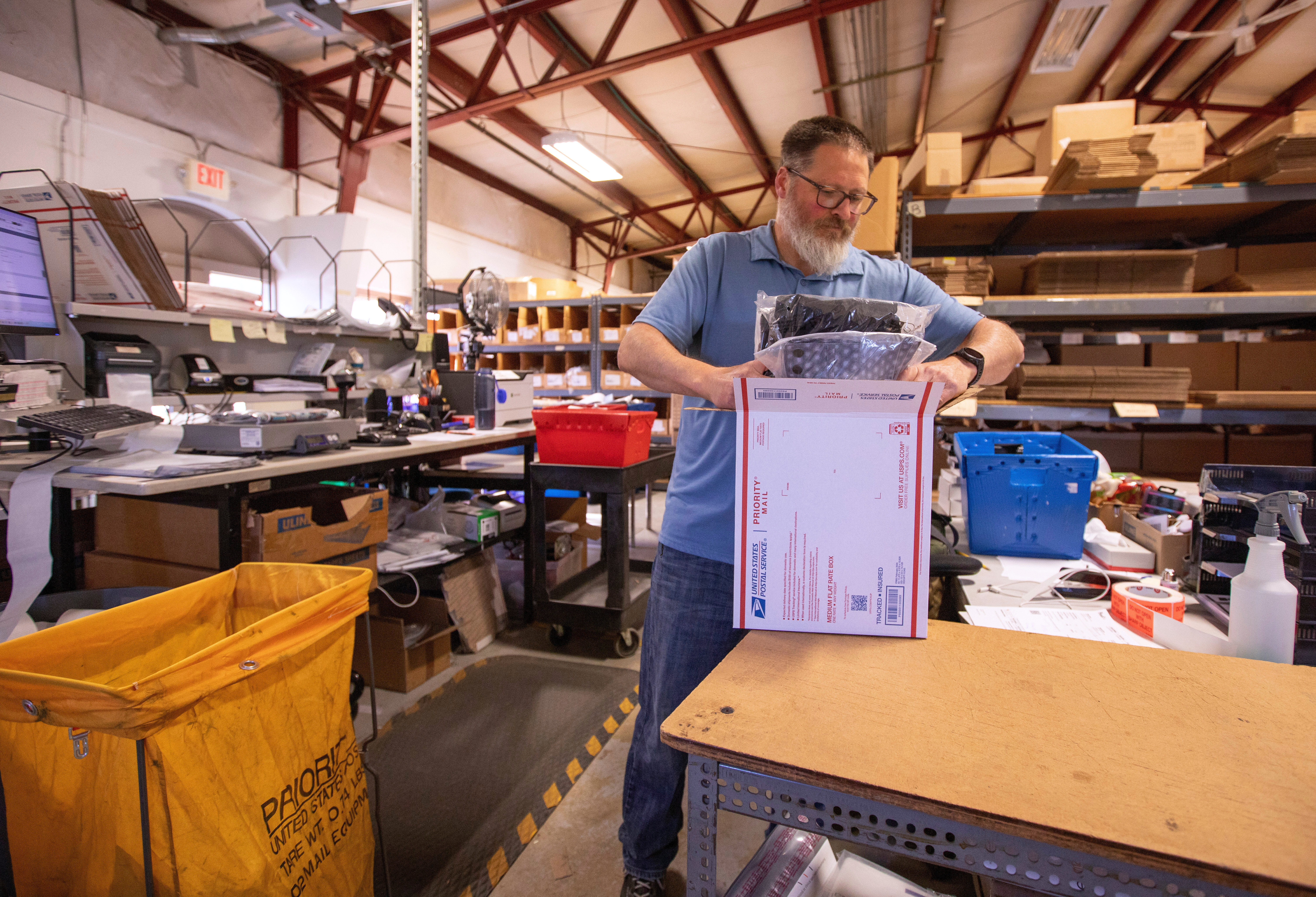 Terry Precision Cycling warehouse manager Luke Tremble packs orders at the company&rsquo;s warehouse in Burlington, Vt., Oct. 28, 2025.