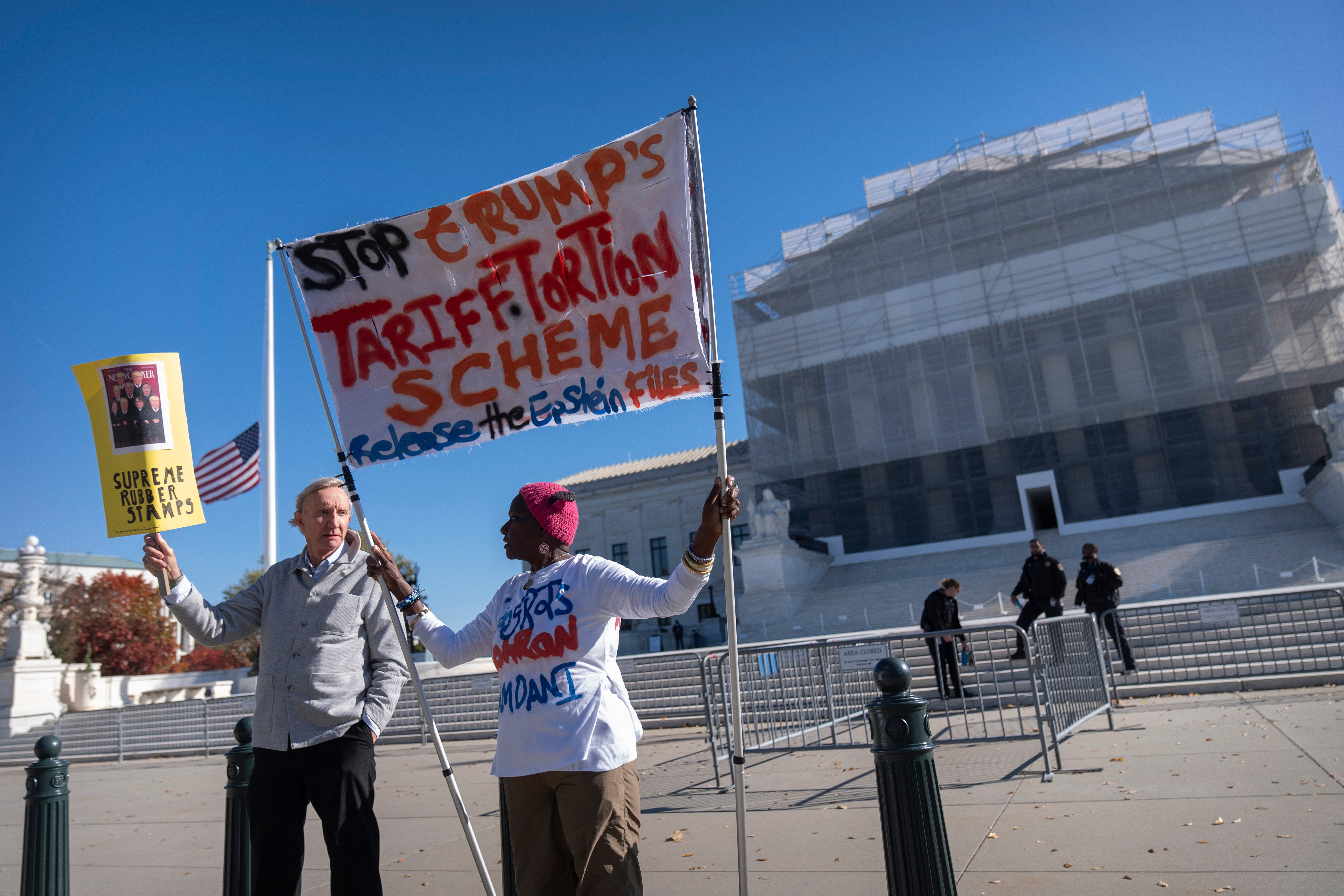 Protesters stand outside the Supreme Court, Nov. 5, 2025, Washington.