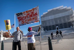 Protesters stand outside the Supreme Court, Nov. 5, 2025, Washington.