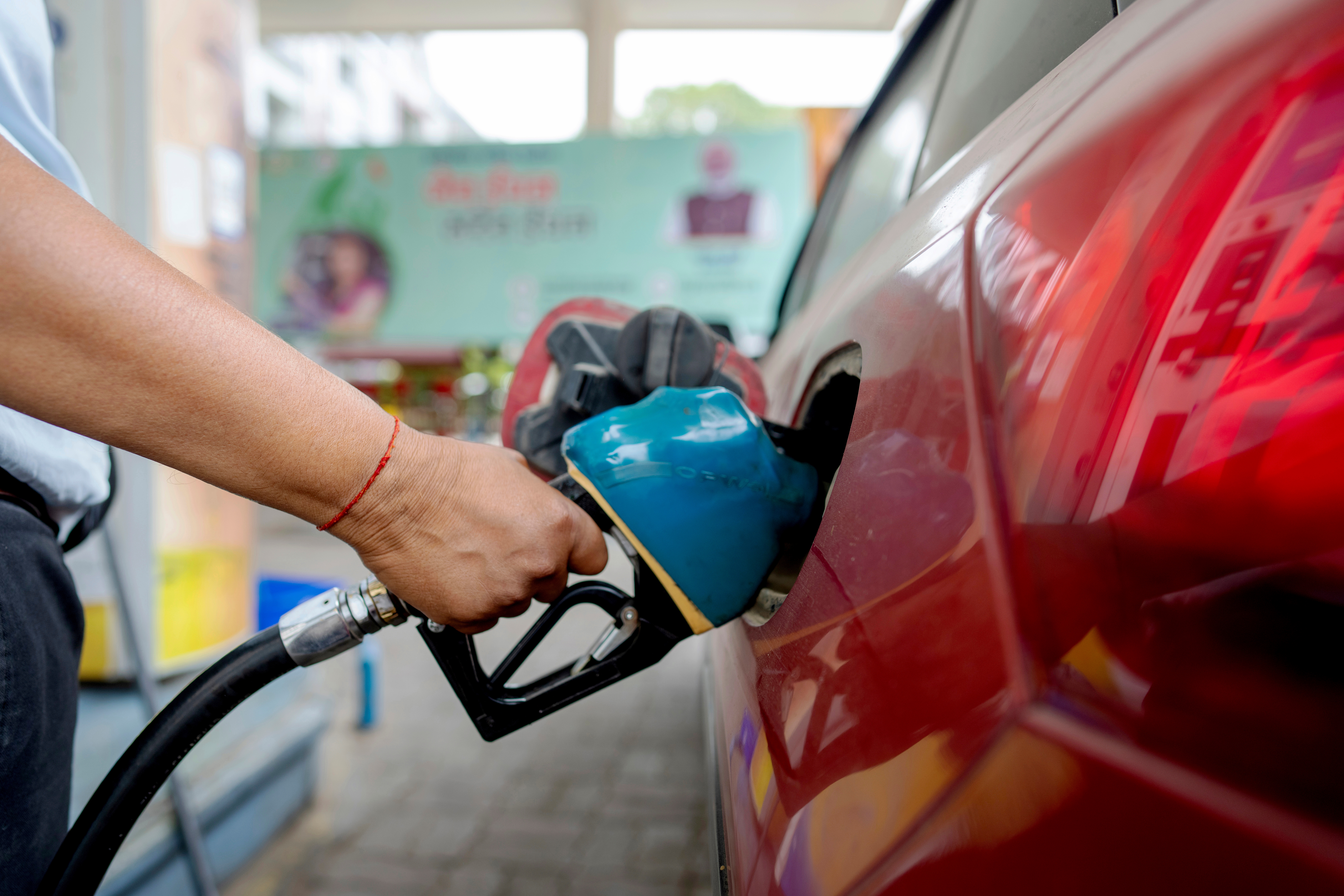 An Indian man fills petrol at a fuel pump in Prayagraj, in the northern Indian state of Uttar Pradesh, May 5, 2025.