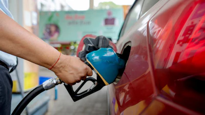 An Indian man fills petrol at a fuel pump in Prayagraj, in the northern Indian state of Uttar Pradesh, May 5, 2025.