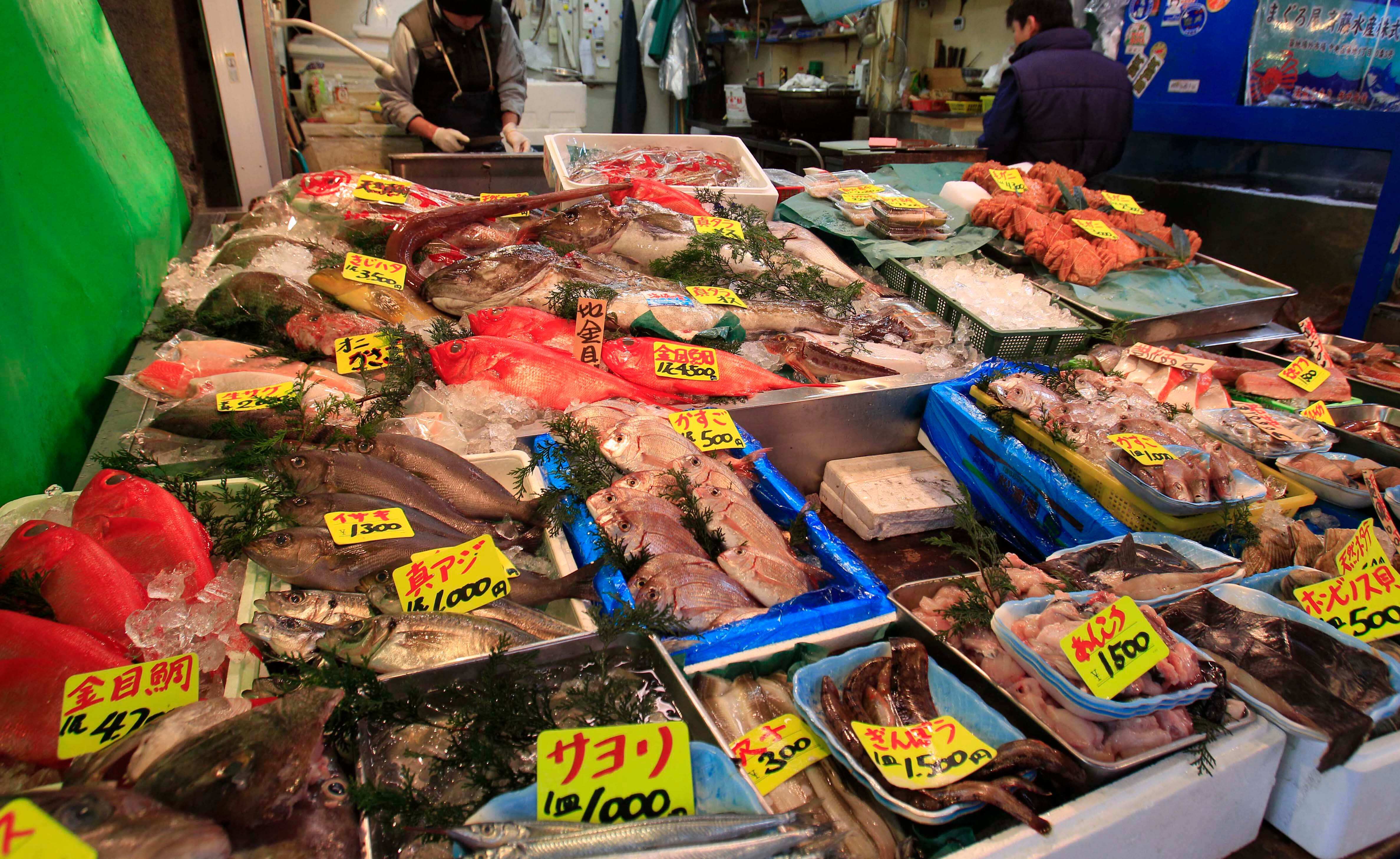 In this March 23, 2011, file photo, various types of fish are sold at a shop near the Tsukiji Fish Market in Tokyo.