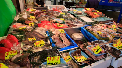 In this March 23, 2011, file photo, various types of fish are sold at a shop near the Tsukiji Fish Market in Tokyo.