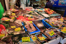 In this March 23, 2011, file photo, various types of fish are sold at a shop near the Tsukiji Fish Market in Tokyo.
