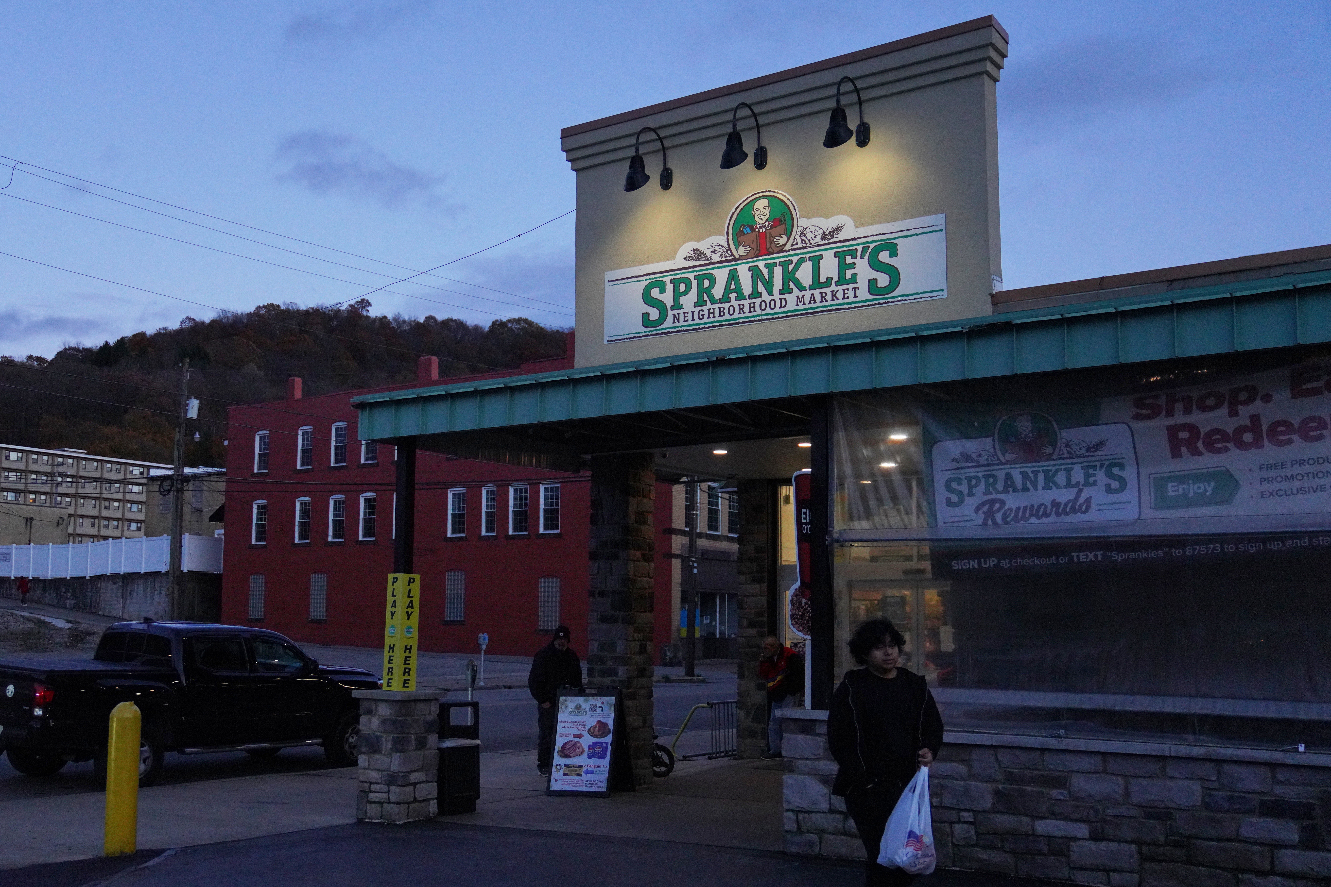 People leave Sprankle's Neighborhood Market, Monday, Nov. 10, 2025, in Kittanning, Pa.