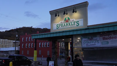 People leave Sprankle's Neighborhood Market, Monday, Nov. 10, 2025, in Kittanning, Pa.