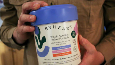 Stephen Dexter holds a container of ByHeart baby formula, which was recently recalled by ByHeart, in Flagstaff, Ariz., on Wednesday, Nov. 12, 2025.