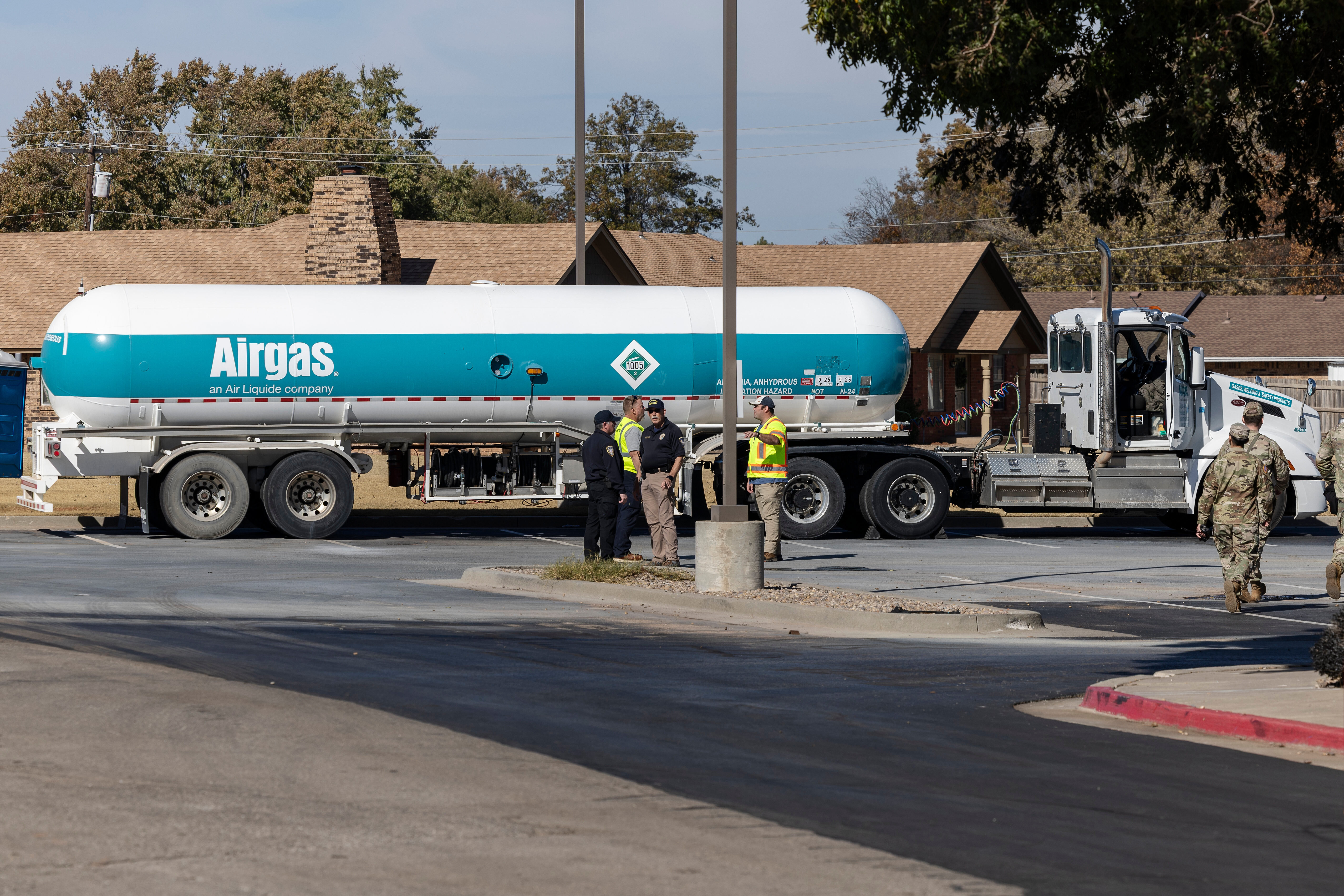 Crews check an Airgas tanker that leaked in the parking lot of a Holiday Inn Express in Weatherford, Okla., Nov. 13, 2025.