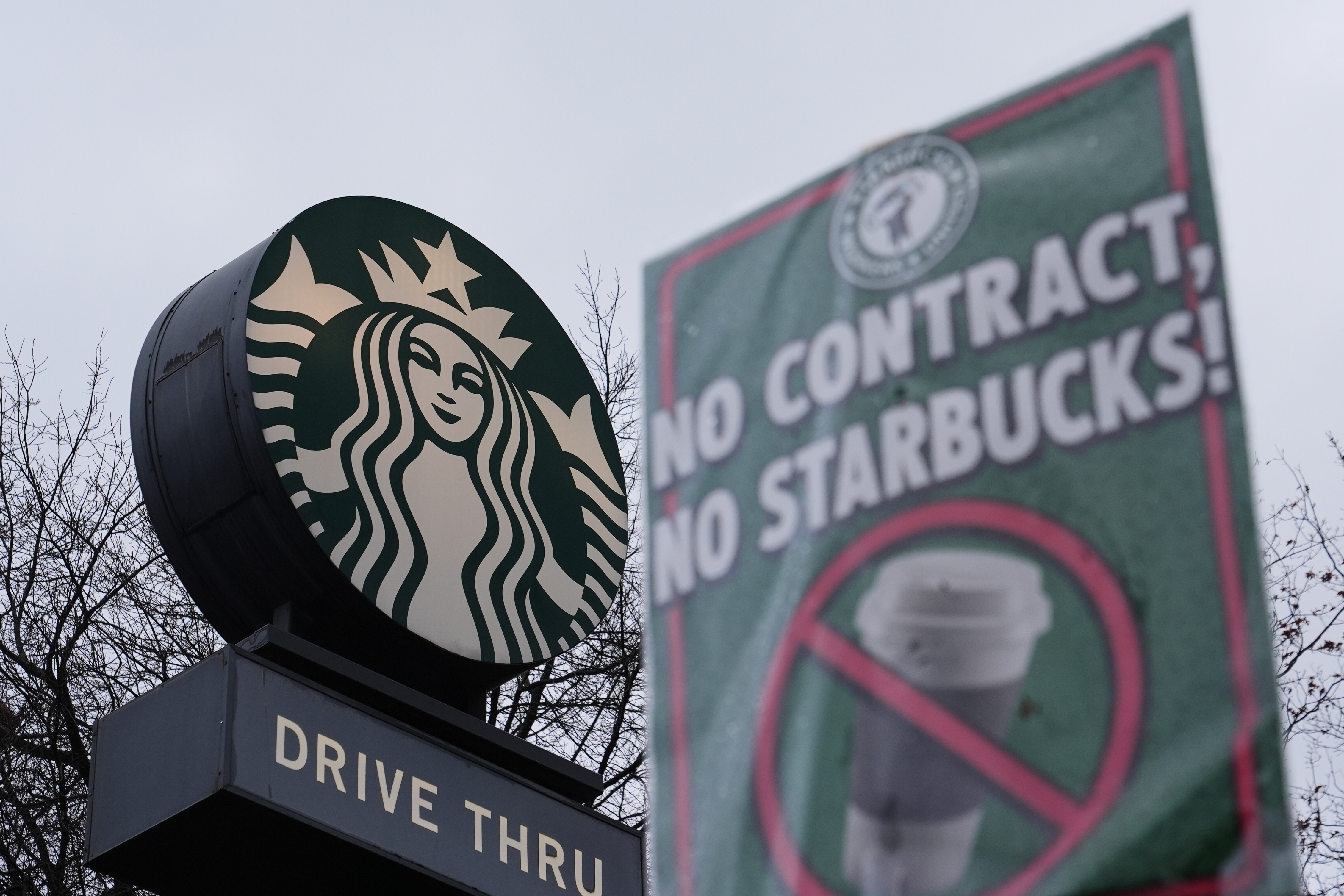 The Starbucks logo is seen as workers strike outside a store Thursday, Nov. 13, 2025, in Seattle.