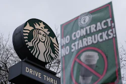 The Starbucks logo is seen as workers strike outside a store Thursday, Nov. 13, 2025, in Seattle.