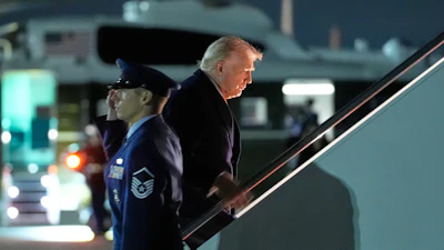 President Donald Trump boards Air Force One at Joint Base Andrews, Md., on his way to his Mar-a-Lago estate in Palm Beach, Fla., Friday, Nov. 14, 2025.