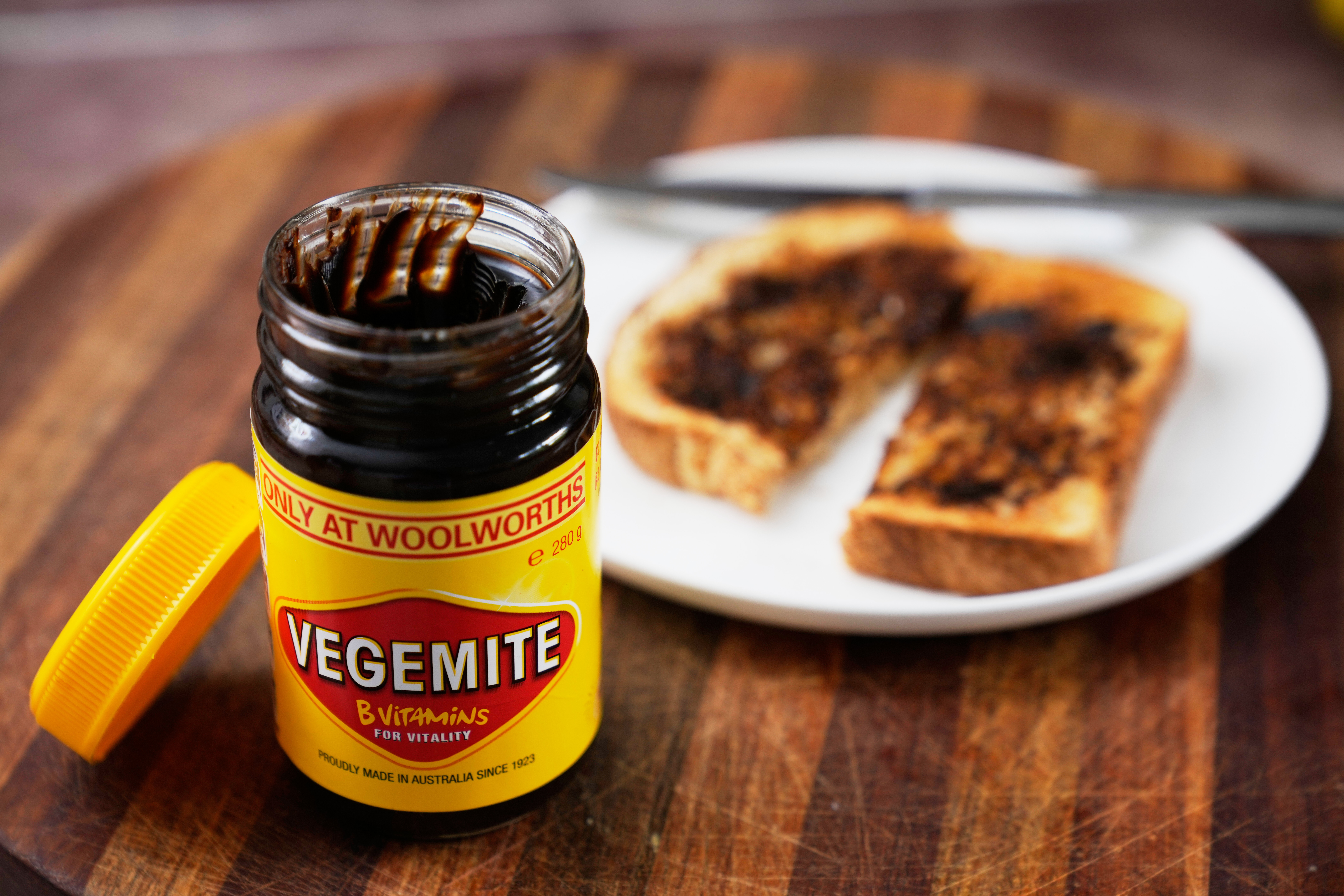 A piece of toast is prepared with Vegemite in Sydney, Australia, Nov. 17, 2025.