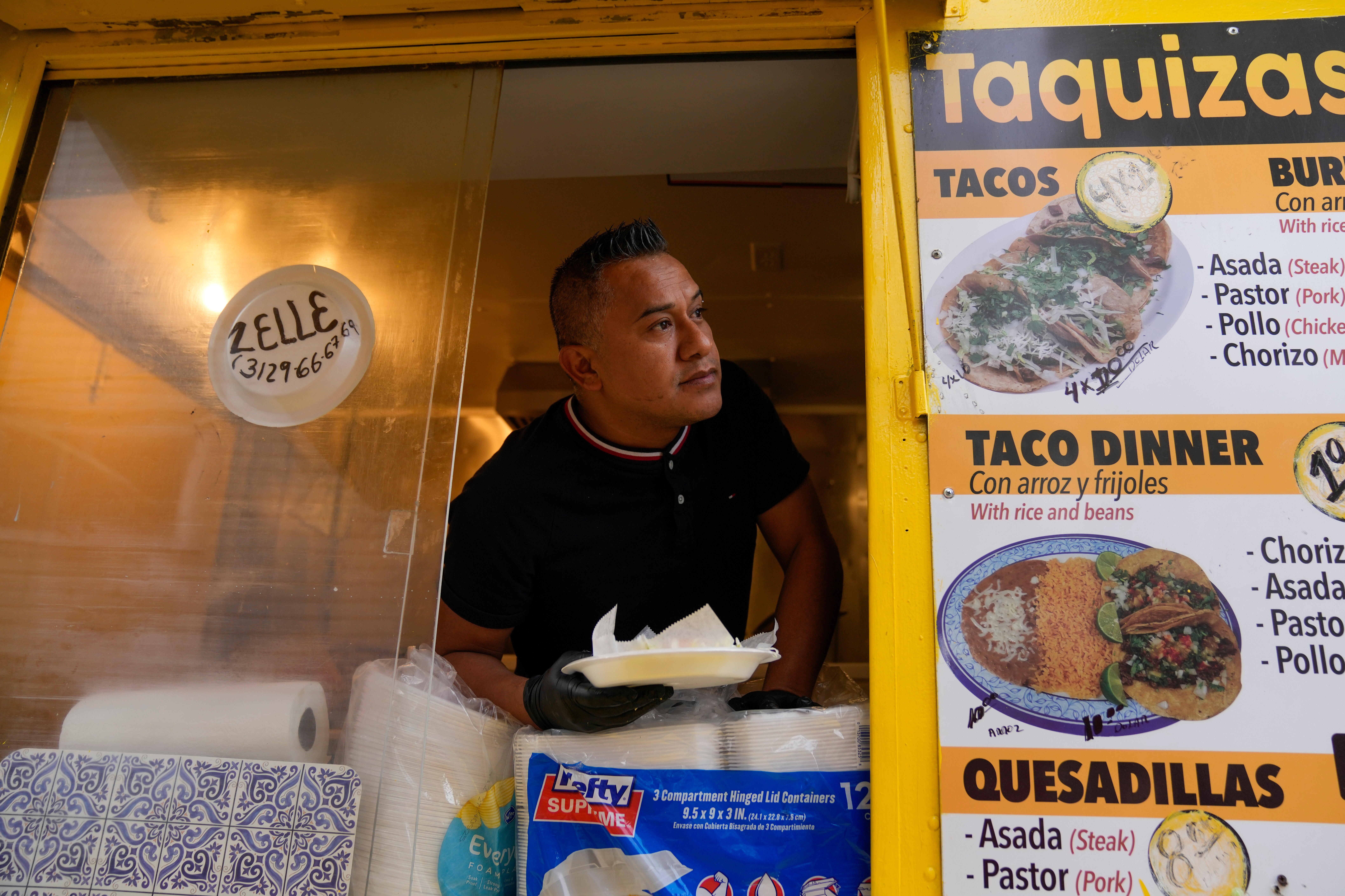 Rafael Hernandez, originally from Mexico, sells food from his family's food truck, Nov. 6, 2025, in Chicago.