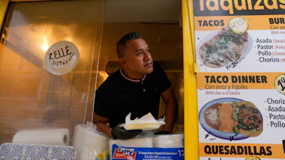 Rafael Hernandez, originally from Mexico, sells food from his family's food truck, Nov. 6, 2025, in Chicago.