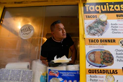 Rafael Hernandez, originally from Mexico, sells food from his family's food truck, Nov. 6, 2025, in Chicago.