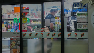 A customer lines up to pay at a convenience store in Bangkok, Dec. 3, 2025.