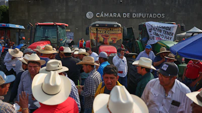 Farmers protest a proposed water law outside the Chamber of Deputies in Mexico City, Wednesday, Dec. 3, 2025.