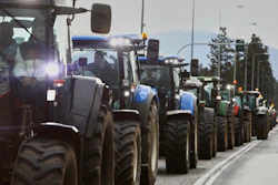 Farmers with their tractors try to block the main access road to Thessaloniki's international airport, Dec. 5, 2025.