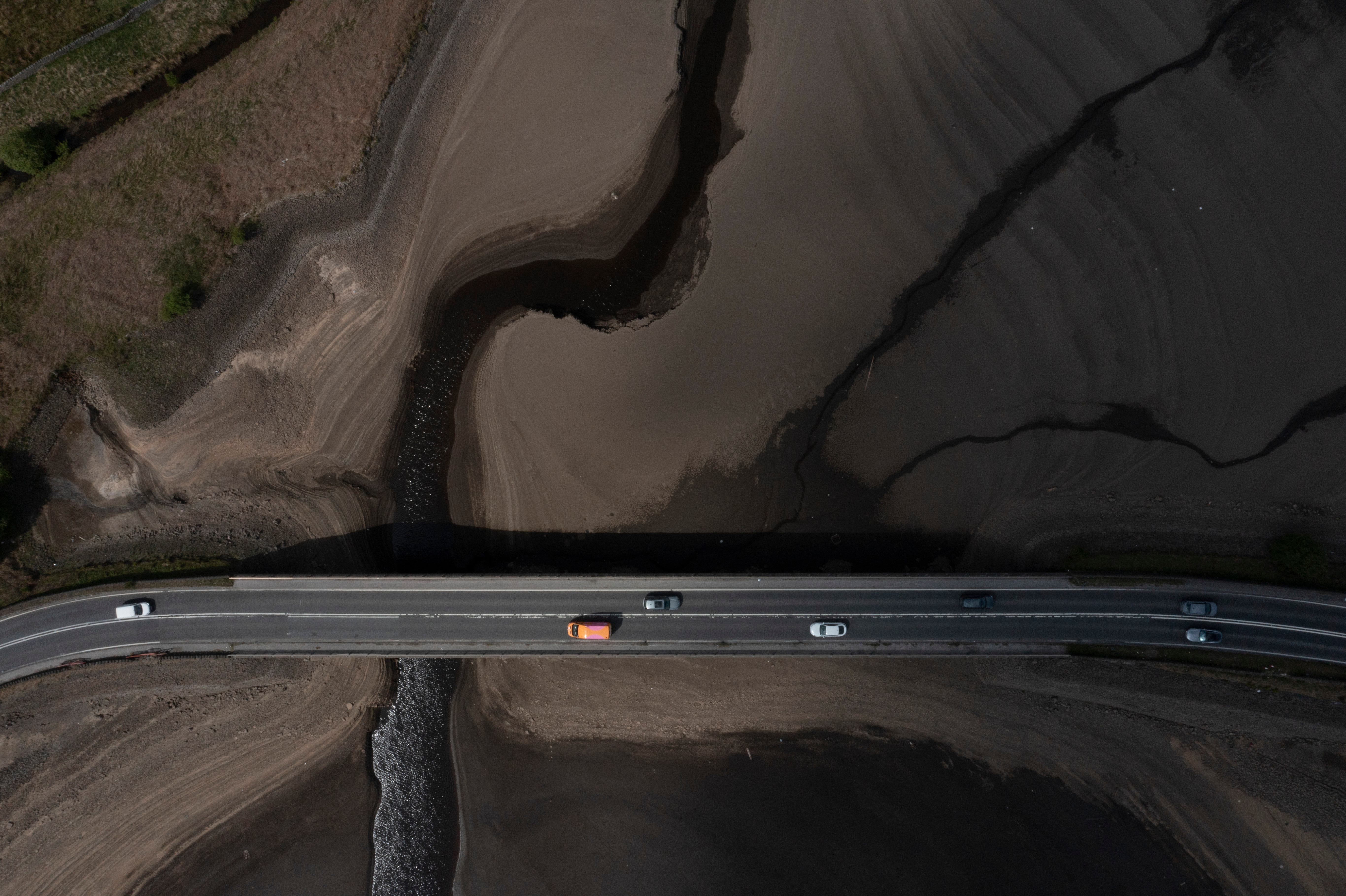 Traffic crosses a bridge at Woodhead Reservoir in Woodhead, England, May 19, 2025.