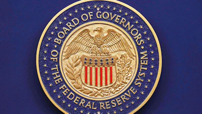 The Federal Reserve seal displayed during a news conference at the Federal Reserve Board Building in Washington, Sept. 17, 2025.