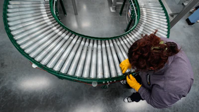 Maintenance technician Liz Cardenas replaces a conveyor belt roller at a training area in a Walmart distribution center Thursday, Sept. 25, 2025, in Bentonville, Ark.