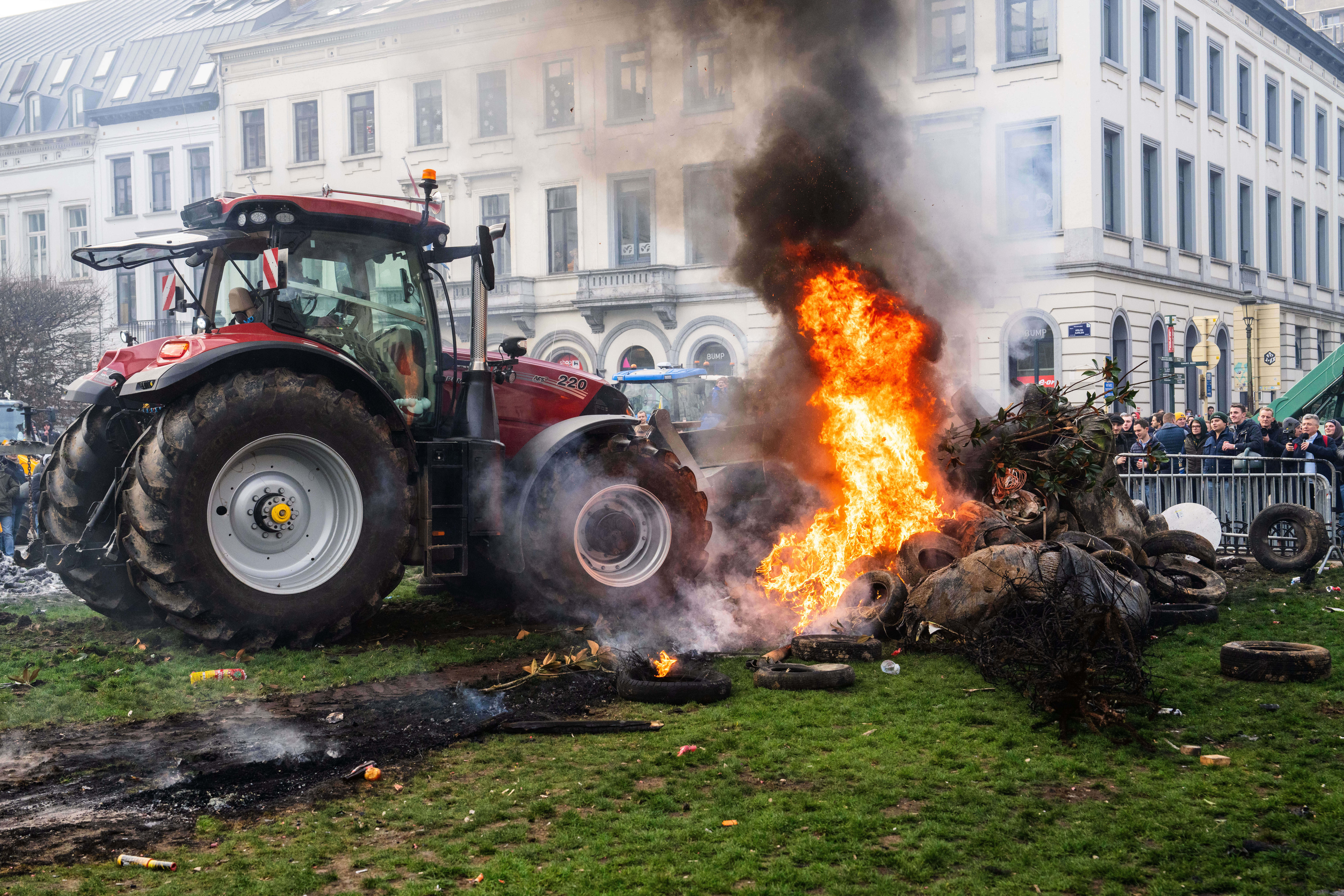 Protestors burn tires during a demonstration of European farmers outside the EU Summit meeting in Brussels, Dec. 18, 2025.