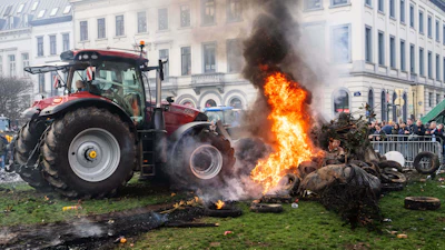 Protestors burn tires during a demonstration of European farmers outside the EU Summit meeting in Brussels, Dec. 18, 2025.