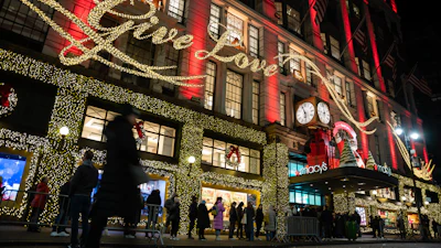 Shoppers wait in line to enter Macy's flagship store, Nov. 28, 2025, New York.