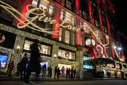 Shoppers wait in line to enter Macy's flagship store, Nov. 28, 2025, New York.