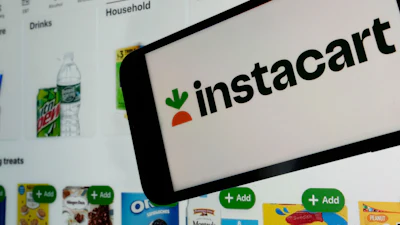 An instacart logo and an instacart webpage are seen in New York, Sept. 6, 2023.